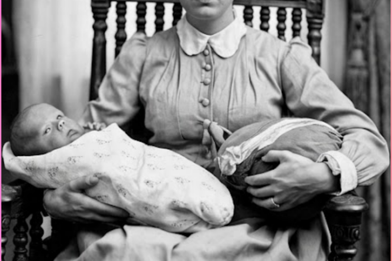 In 1906, a mother holds her baby—until everyone freezes when they see what she is holding